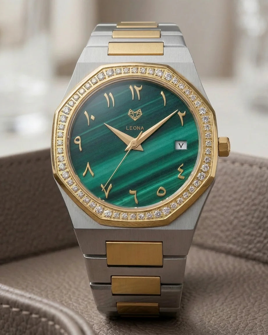 Luxury watch with green face and gold accents on a textured surface