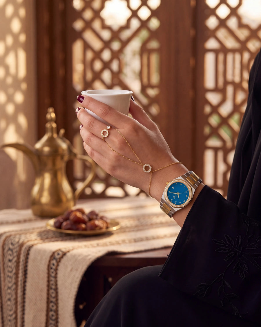 Marquise Blue watch with the hand chain and ring over Arabic coffee in a majlis