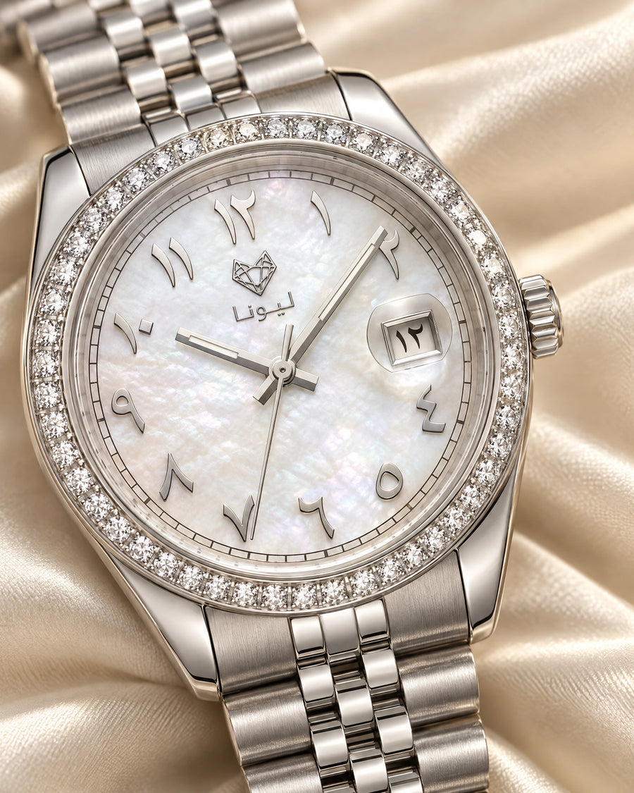 Leona Perla White watch close-up: white mother-of-pearl dial, Arabic numerals and crystal bezel